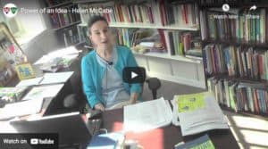 video scfeengrabof Dr Helen McCabe at a desk